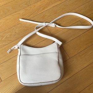White leather purse.